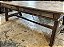 Antiga mesa cavalete em madeira nobre no tom mel , duas gavetões, pés em cavalete com trava , impecável, mede 2,50x90x80 cm altura - Imagem 1