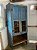 Maravilhoso armário de fazenda em madeira nobre com restos de policromia de época , azul, duas portas com vidro, vão aberto na parte interna , pés recortados, ótimo estado, mede 2,23x98x55 cm profundidade - Imagem 1