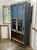 Maravilhoso armário de fazenda em madeira nobre com restos de policromia de época , azul, duas portas com vidro, vão aberto na parte interna , pés recortados, ótimo estado, mede 2,23x98x55 cm profundidade - Imagem 2