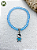 Pulseira de Erês Ibeji – Miçangas Jablonex com Pingente Menino ou Menina | Umbanda e Candomblé - Imagem 3
