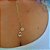 Colar Gravatinha com Pingente de Menina e Patinha Cravejada com Zircônias Cristal Banho em Ouro 18K - Imagem 1