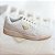 Tenis off white com detalhes dourados - Imagem 1