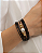 Bracelete preto com pérola no centro acabamento folheado a ouro 18K hipoalergênico. - Imagem 1