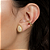 Brinco Gota Cravejada Incolor Entorno Torcido Banho de Ouro 18k - Imagem 2