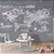 Papel de Parede Infantil de Mapa Mundi em Tons de Cinza com Nuvens e Aviões - Imagem 2