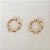 Brinco circular torcido folheado a ouro 18k - Imagem 1