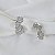 Brinco ear cuff flores zircônia ródio semijoia 26k03011 - Imagem 4
