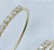 Brinco Meia Argola com Strass Folheado à Ouro 18K - Imagem 4
