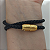 Pulseira courino trançado cor preta 2 voltas com cano e fecho imã  folheado em ouro - Imagem 2
