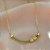 COLAR FIO CURVADO MINI TREVOS DOURADO AÇO 316L⭐️ - Imagem 4
