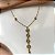 COLAR GRAVATINHA TREVO PEDRAS ZIRCÔNIAS DOURADO AÇO 316L⭐️ - Imagem 1