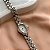 RELÓGIO FEMININO OVAL COM STRASS PRATEADO BIJU - Imagem 1