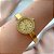 BRACELETE RELÓGIO REDONDO COM BORDA COM STRASS DOURADO AÇO 316L⭐️ - Imagem 4