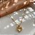 COLAR LONGO PINGENTE CORAÇÃO VAZADO MINI ZIRCÔNIA DOURADO AÇO 316L⭐️ - Imagem 1