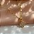 COLAR LONGO PINGENTE TREVO MINI ZIRCÔNIA DOURADO AÇO 316L⭐️ - Imagem 1