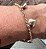 PULSEIRA TUBULAR COM PINGENTES DE CORAÇAO BANHADA A OURO 18 K - Imagem 4