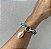 PULSEIRA CORRENTE ESMALTADA AZUL COM BUZIO BANHADA A OURO 18 K - Imagem 1