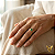 Anel em ouro 18k com esmeralda e 18 diamantes naturais - Imagem 4