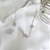 Conjunto de Flor Cravejado em Micro Zircônias em Rhodium Branco - Imagem 5