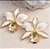 BRINCO FLOR DO CERRADO ESMALTADA BRANCA COM GOTINHA TURMALINA NO BANHO OURO18K - Imagem 1