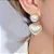 Brinco coração pérola cravejado com micro zirconias coloridas no banho ouro18k - Imagem 1