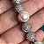 Pulseira cravejada zircônias na cor cristal e pérolas shell 19cm de comprimento com banho de ródio branco - Imagem 7