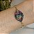 Pulseira olho grego cravejado zircônias coloridas (rainbow) caneta ródio negro com banho de ouro 18k - Imagem 2
