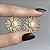 Brinco flor com pérola shell cravejada com zircônias na cor cristal com banho de ouro 18k - Imagem 18