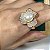 Anel de flor 3 pétalas cravejadas com zircônias cristal e pérola shell com banho de ouro 18k - Imagem 1