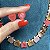 Conjunto brinco e colar cravejado com zircônias em formato de coração em degradê tons de coral com banho de ouro 18k - Imagem 4
