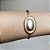 Pulseira bracelete detalhe oval acetinado fosco 18cm com banho de ouro 18k e ródio branco - Imagem 7