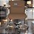 Cadeira Original Eames Diretor com Rodinhas Cromadas e Anti Risco Linha Capa em Madeira Caramelo - Imagem 2