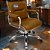 Cadeira Original Eames Diretor com Rodinhas Cromadas e Anti Risco Linha Capa em Madeira Caramelo - Imagem 1