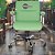 Cadeira Original Eames Diretor com Rodinhas Cromadas e Anti Risco Linha Capa em Madeira Verde Limão - Imagem 2