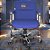 Cadeira Original Eames Diretor com Rodinhas Cromadas e Anti Risco Linha Capa em Madeira Azul Royal - Imagem 2