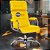 Cadeira Original Eames Presidente com Rodinhas Cromadas e Anti Risco Linha Capa em Madeira Escura - Amarelo - Imagem 1