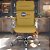 Cadeira Original Eames Presidente com Rodinhas Cromadas e Anti Risco Linha Capa em Madeira Clara - Amarelo Mostarda - Imagem 2