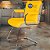 Cadeira Original Eames Interlocutor Cromada Linha Capa em Madeira Clara - Amarelo - Imagem 1