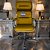 Cadeira Original Eames Presidente com Rodinhas Black e Anti Risco Linha Capa em Madeira - Amarelo Mostarda - Imagem 2