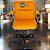 Cadeira Original Eames Diretor com Rodinhas Black e Anti Risco Linha Capa em Madeira - Laranja - Imagem 2