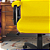 Cadeira Original Eames Presidente com Rodinhas Black e Anti Risco Linha Capa em Madeira Escura - Amarelo - Imagem 4