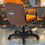 Cadeira Original Eames Diretor com Rodinhas Black e Anti Risco Linha Capa em Madeira Escura - Laranja - Imagem 3