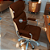 Cadeira Original Eames Presidente com Rodinhas Cromadas e Anti Risco Linha Capa em Madeira Escura ou Clara - Marrom - Imagem 2