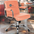 Cadeira Original Eames Diretor com Rodinhas Cromadas e Anti Risco Linha Capa em Madeira Escura Vermelho Telha - Imagem 2