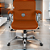 Cadeira Original Eames Diretor com Rodinhas Cromadas e Anti Risco Linha Capa em Madeira Escura Caramelo - Imagem 1