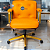 Cadeira Design Office Eames Signature Diretor Dourada com Rodinhas Anti Risco - Capa em Madeira - Laranja - Imagem 1
