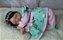 Bebê Reborn Rosalie Cabelo Castanho Escuro Realista - Imagem 3