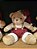 URSO SENTADO COM SUSPENSORIO VERMELHO E BRANCO 25CM - PRÉ VENDA 2025 - Imagem 1
