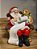 PAPAI NOEL SENTADA NA POLTRONA COM CACHORRO 19CM - Imagem 6