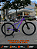 BICICLETA MTB ARO (29) ABSOLUTE HERA 21 VELOCIDADES FREIO A DISCO MECÂNICO TAMANHO 15 (P) COR ROXO/ROSA/AZUL - Imagem 1